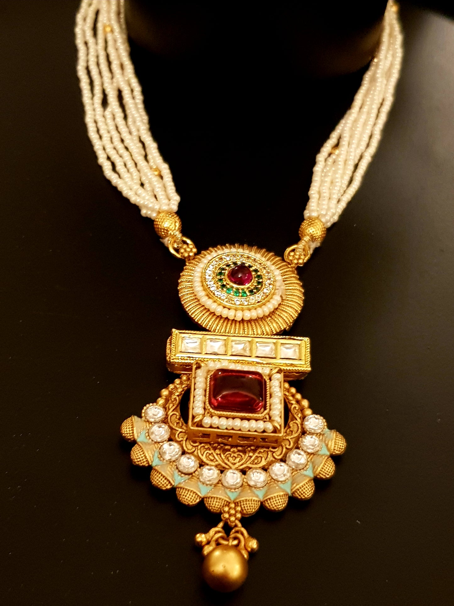 Gold finish set with stone,meenakari and kundan pendant in poth pearl strings with stunning matching jhumkis (earrings)