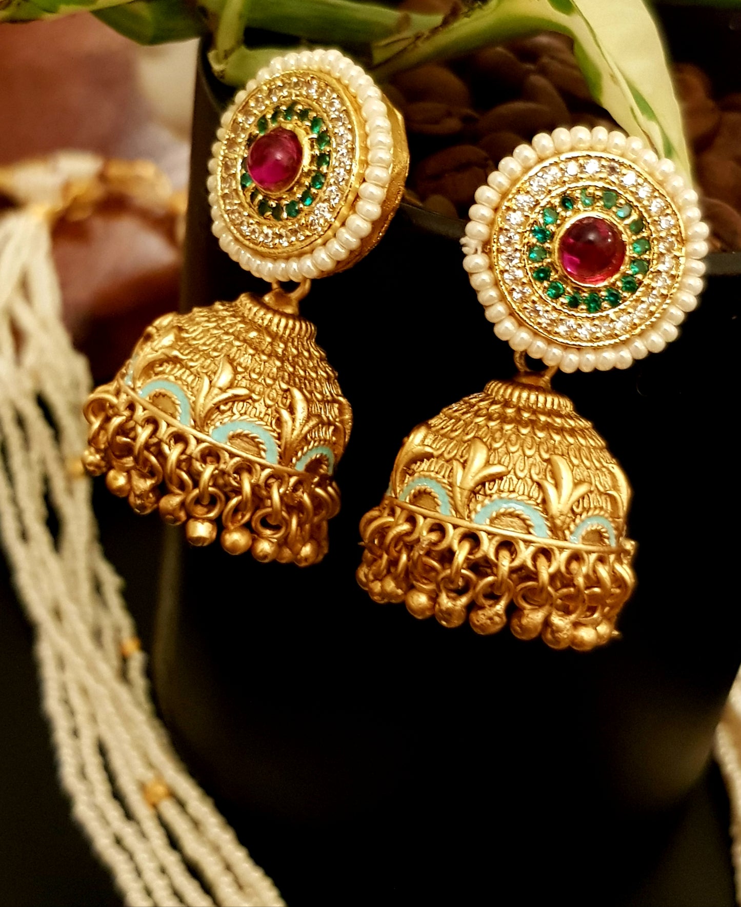 Gold finish set with stone,meenakari and kundan pendant in poth pearl strings with stunning matching jhumkis (earrings)