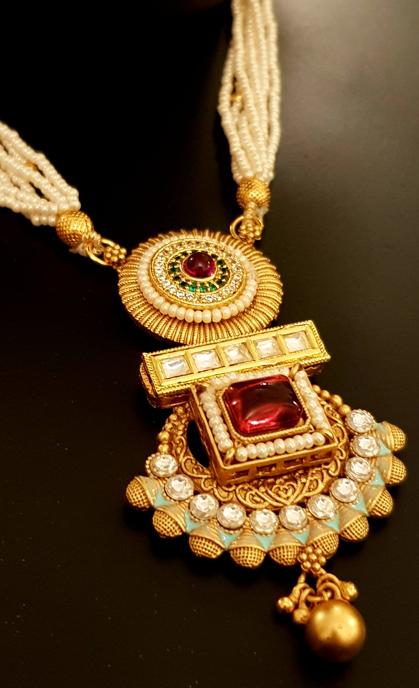 Gold finish set with stone,meenakari and kundan pendant in poth pearl strings with stunning matching jhumkis (earrings)