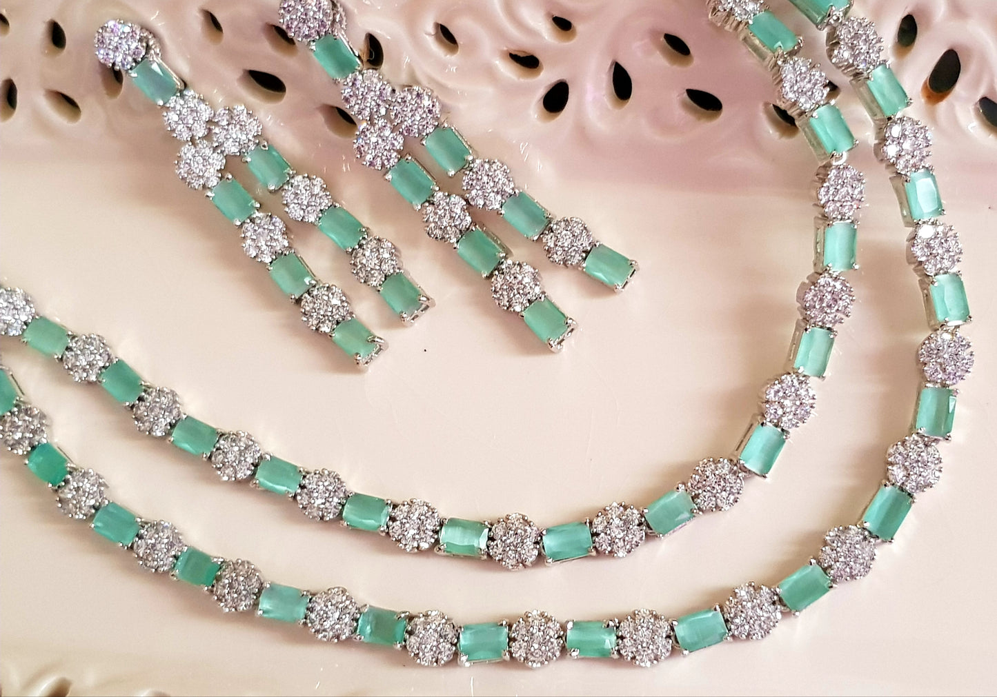 Platinum finish set,dual layered necklace with mint green stone and CZ flower,matching danglers (earrings)