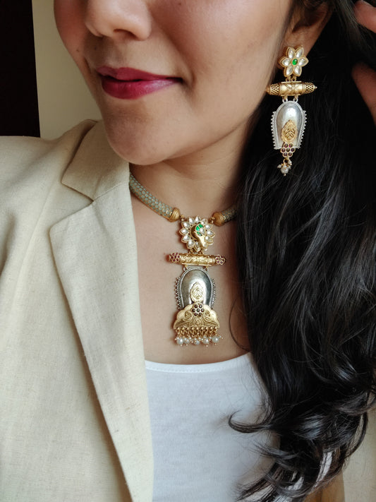 Hasli set with lime green/mauve honeycomb pattern in gold, pearched parrot on kundan piece and below a dual tone design with pearls