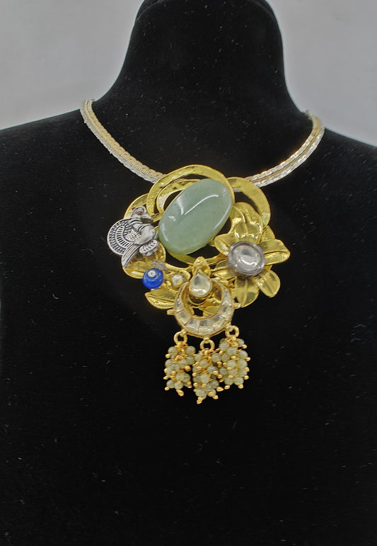 Gold finish web pendant with  mint green stone,kundan and white peacock on dual tone chain