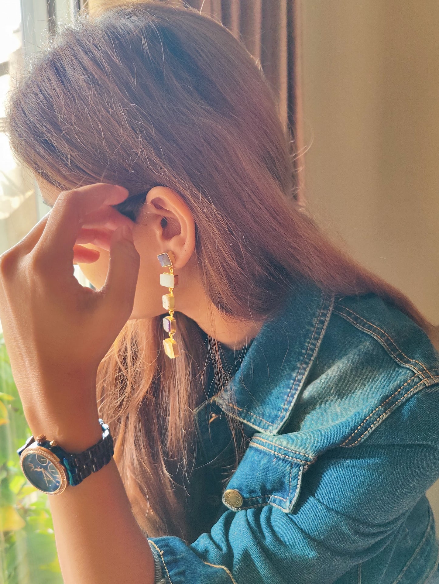 'Grunge' danglers with hand cut gemstones in a matte gold frame