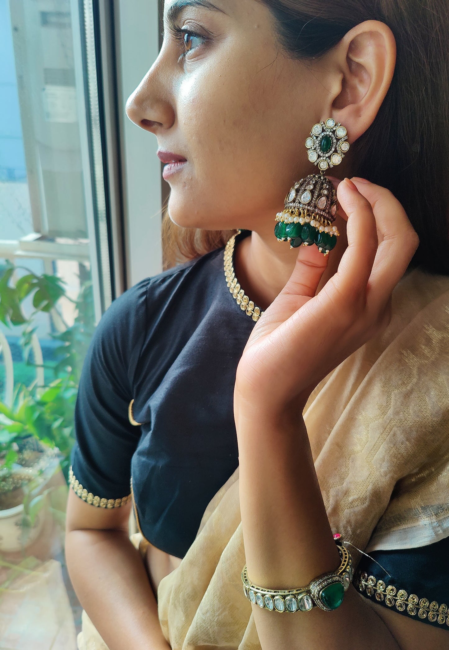 Anmol earrings with kundan and emerald