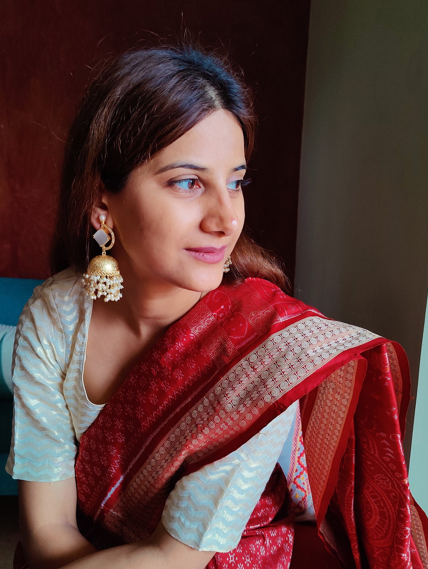 Golden jhumkas(earrings)with stone on D shaped stud