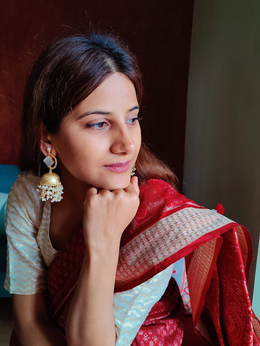 Golden jhumkas(earrings)with stone on D shaped stud