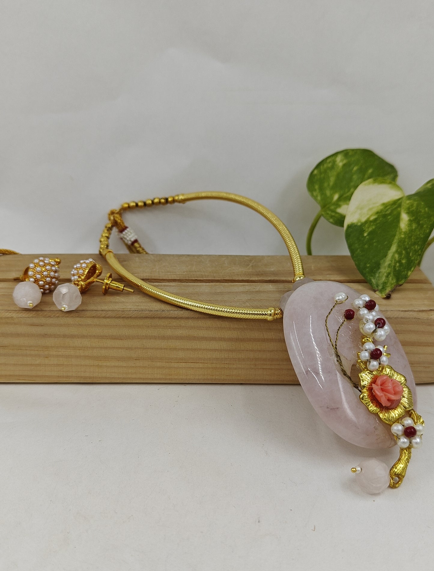 Set with baby pink stone with work on golden pipe hastli