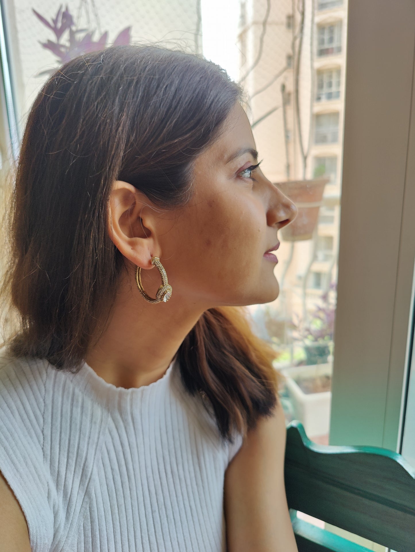 Bali(earrings)with a moissanite surrounded with CZ