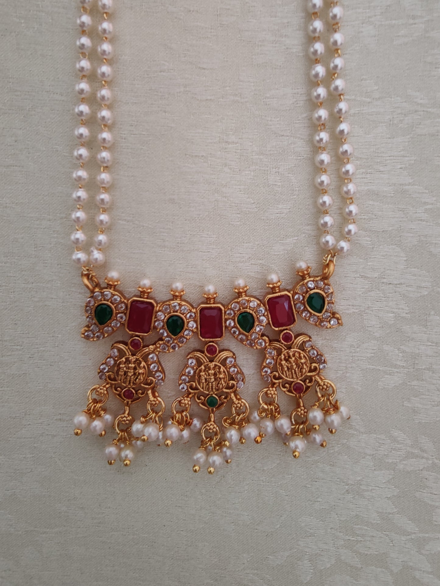 Kalandhika delicate set on pearl strings