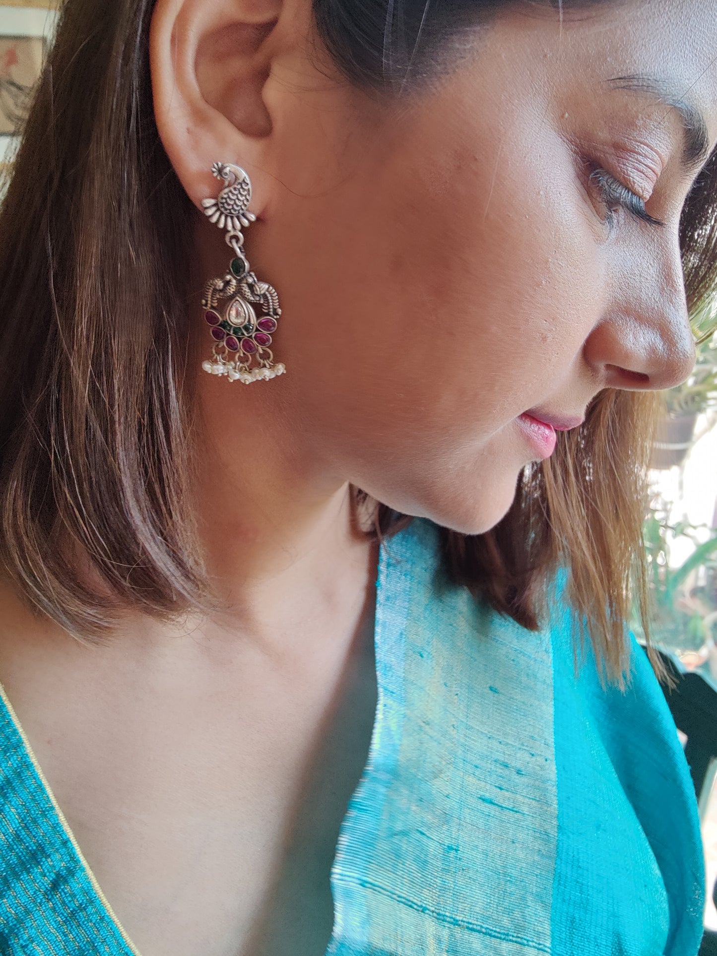 Hasika silver peacock earrings