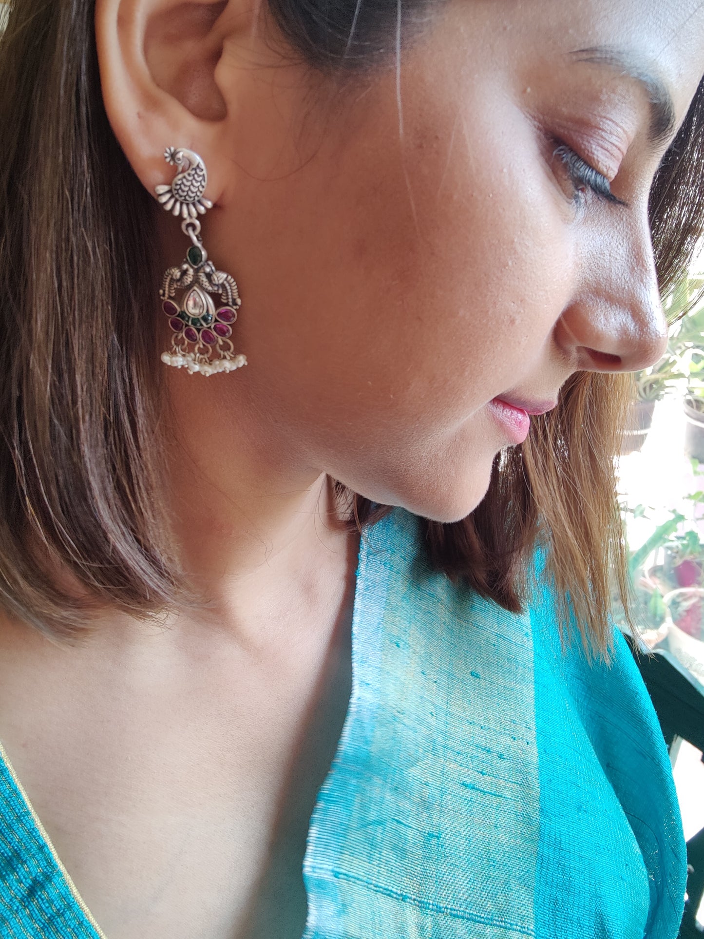 Hasika silver peacock earrings