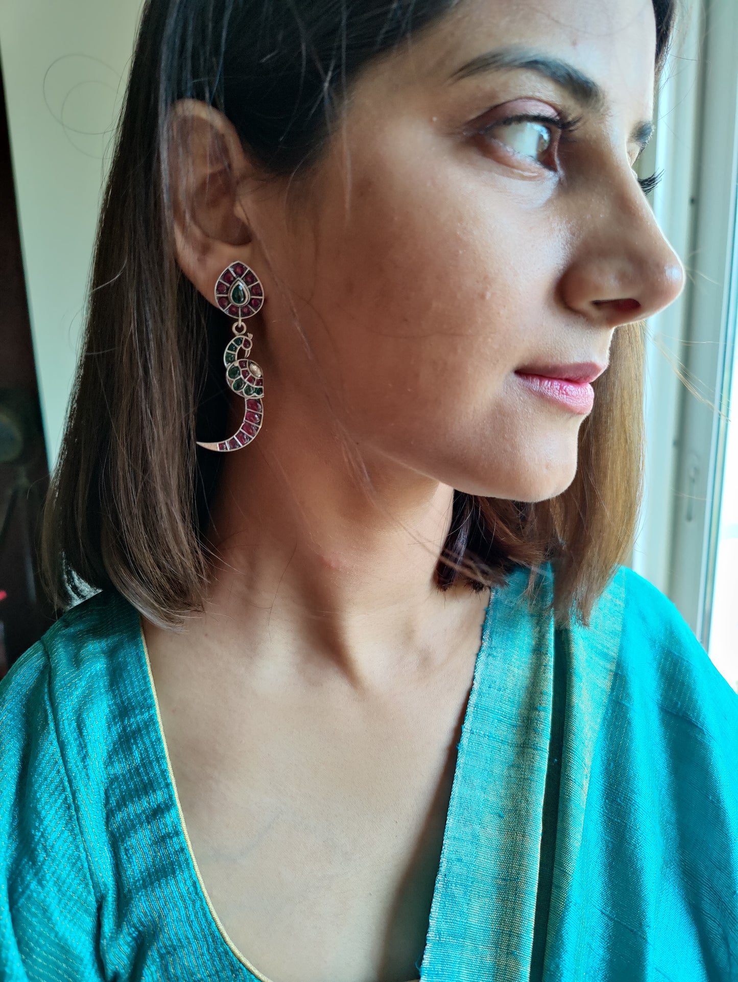 Bala silver peacock earrings with red and green stone