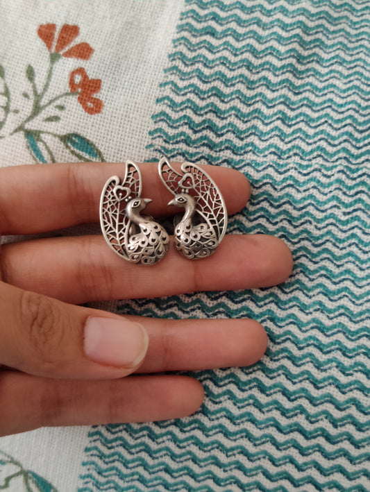 Carved silver peacock studs (earrings)