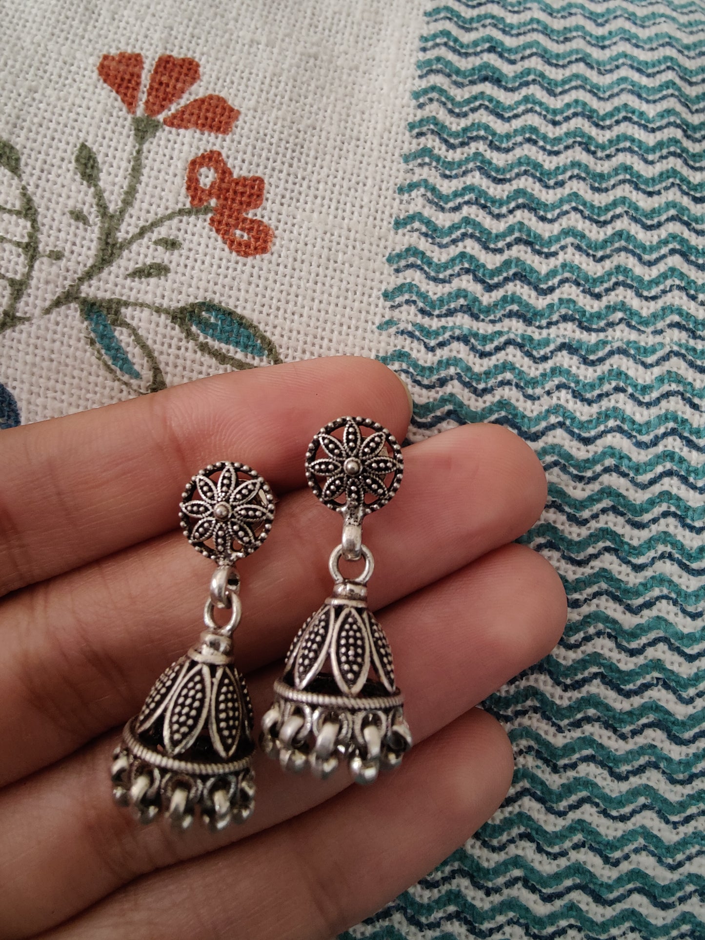 Dilber silver jhumkis with petals and beads