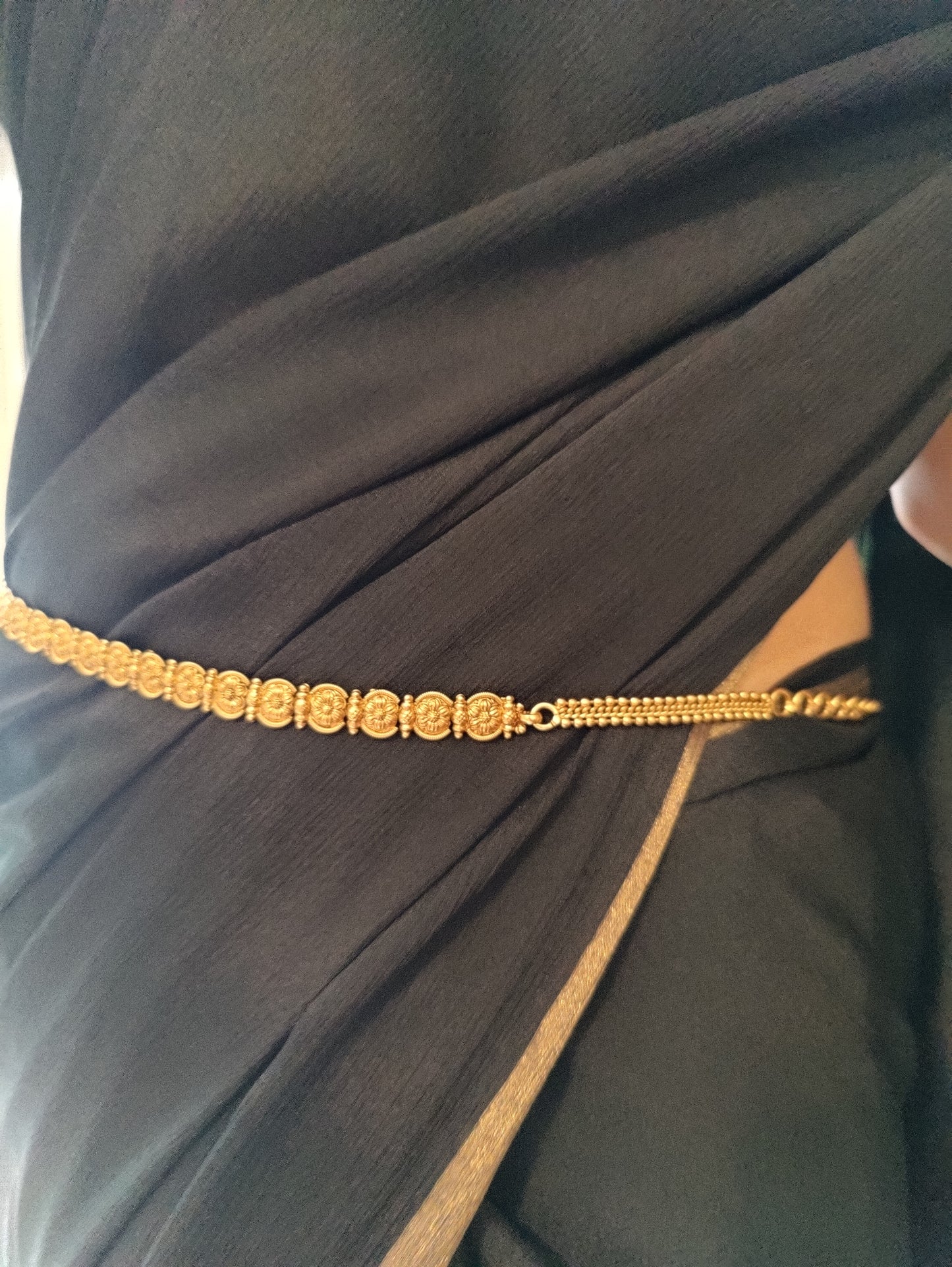 Kuvil belt with carved pieces all around