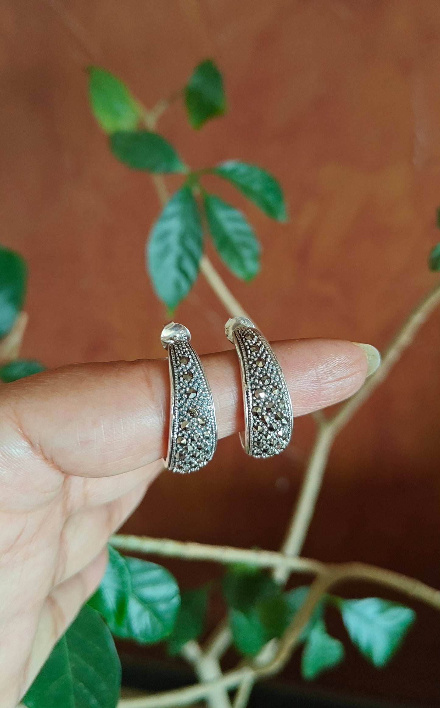 Silver earrings with ruby red stone