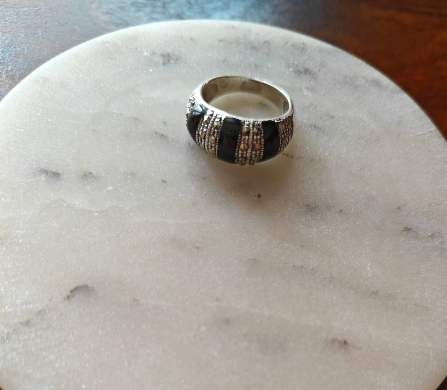 Silver ring with three black bands