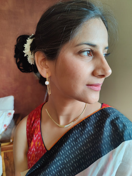 Gold hoop earrings with pearl