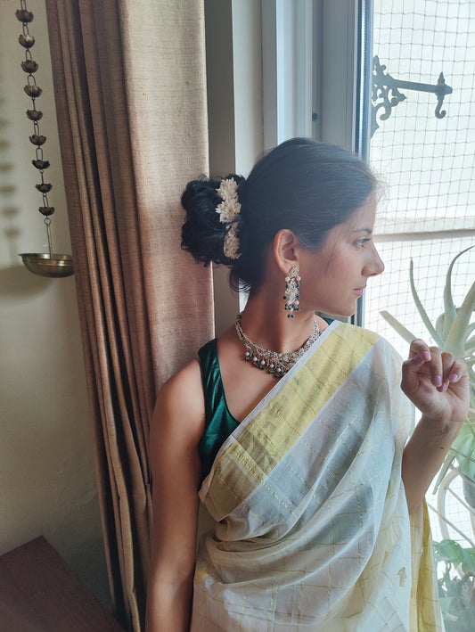 Abja jadau set with emerald green stones and pearls