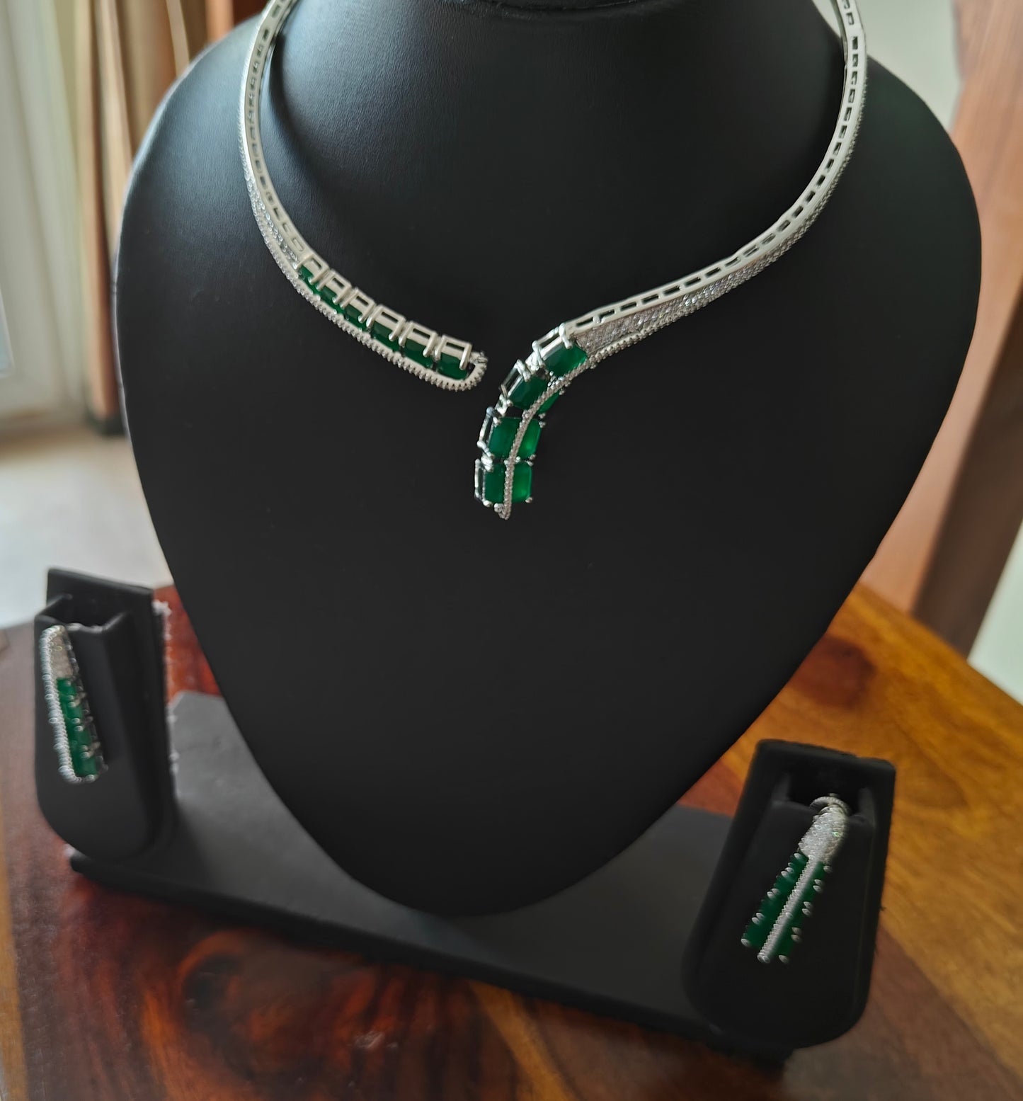 Pival set with green emeralds and Cz