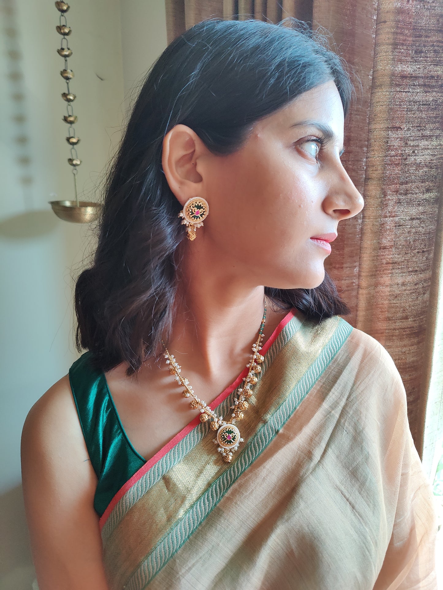 Ratnali set with green stone and gold work