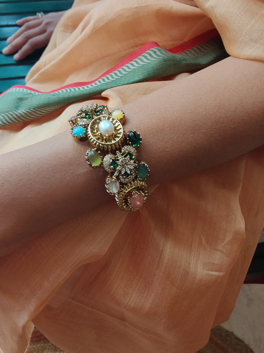 Stone studded kara( bangle) with pearl and different stones