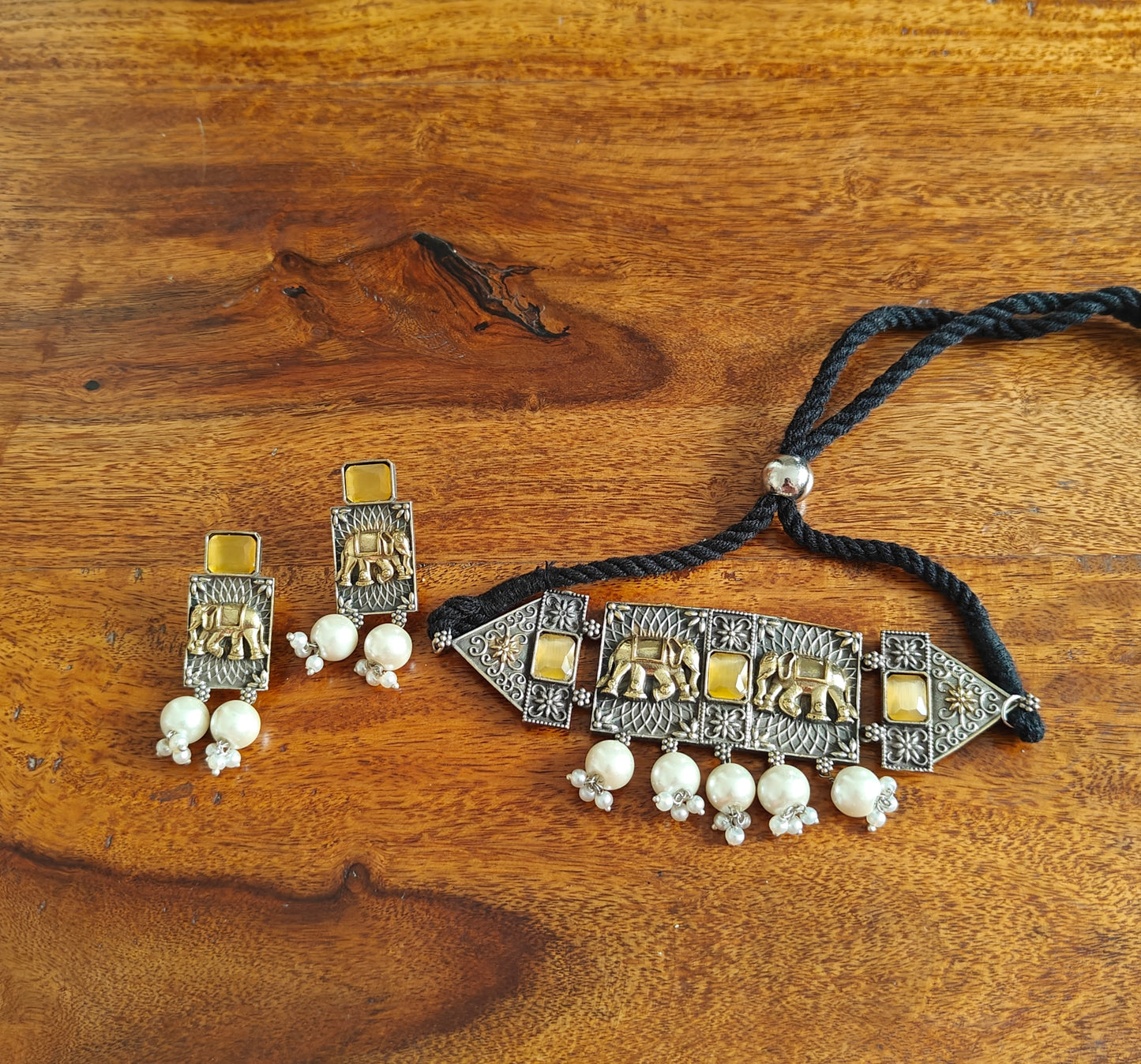 Dual tone choker with elephant engraving and stone