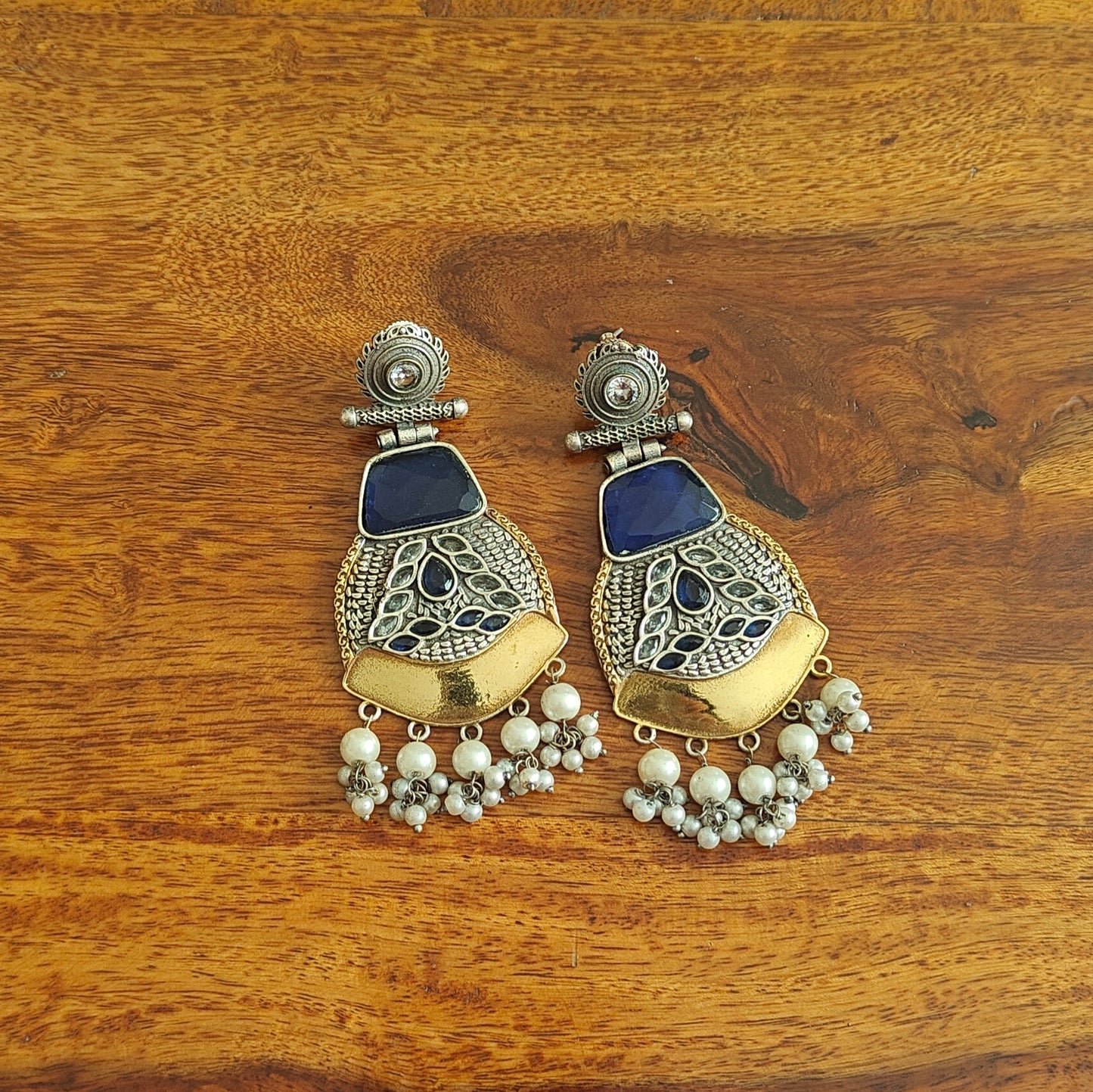 Dual tone earrings with emerald blue stone and pearl hangings