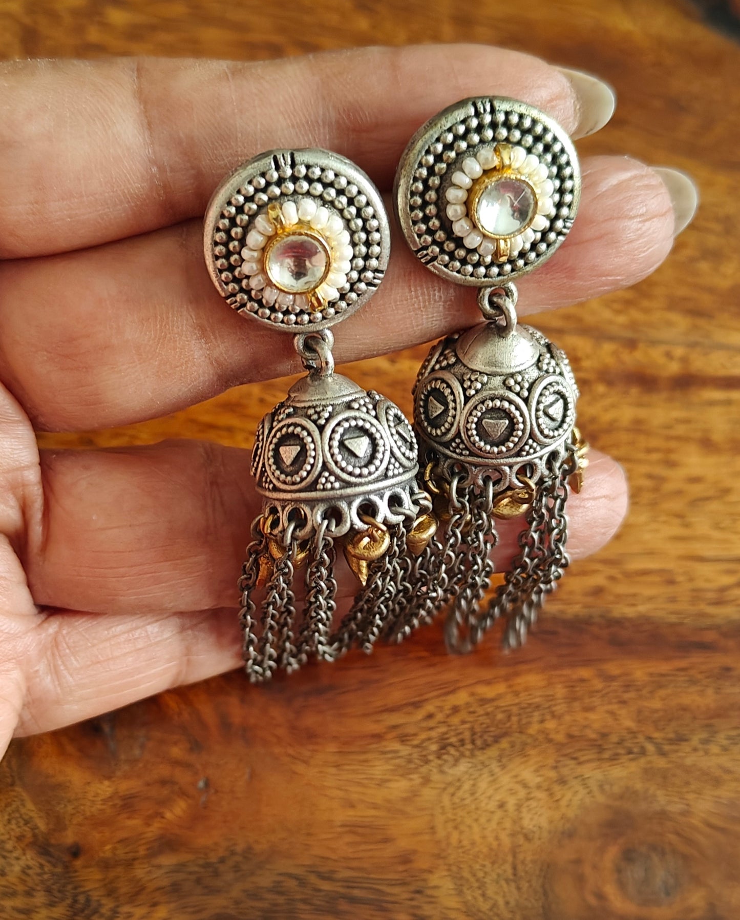 Dual tone jhumkis(earrings)with stone,pearls and chains