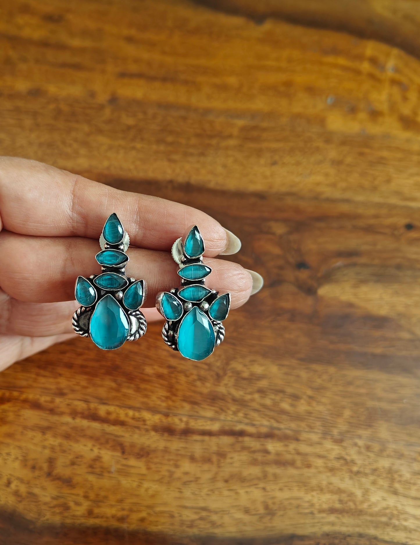 Stone earrings with enhancement