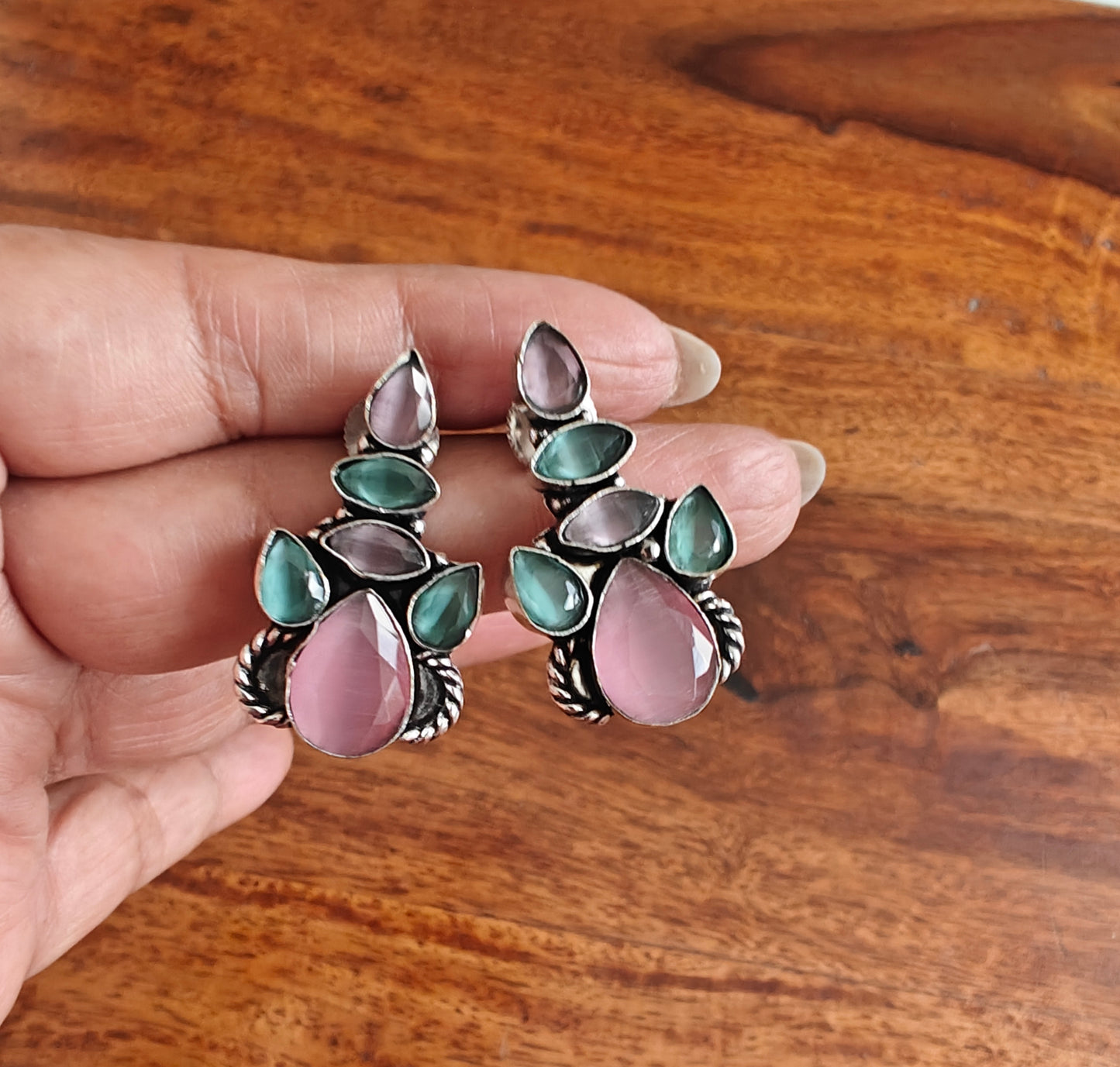 Stone earrings with enhancement