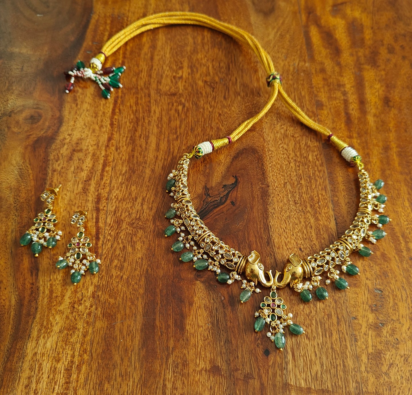 Ganesha hasli set with emerald green hangings