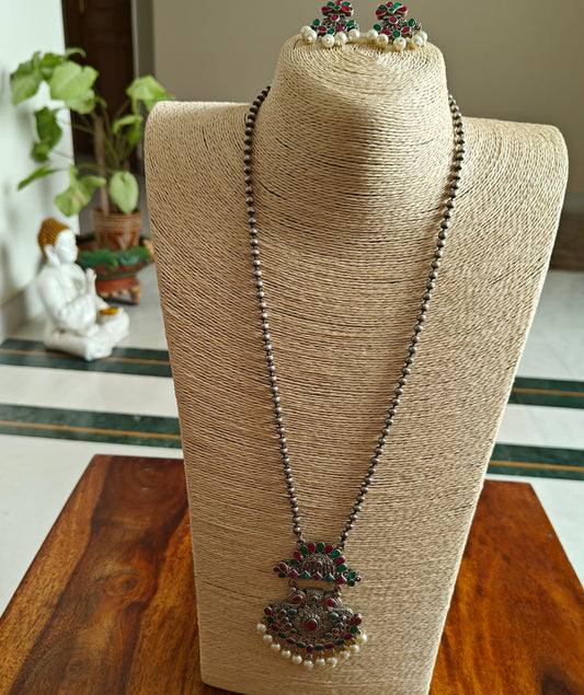 Set on bead chain with pendant with stones