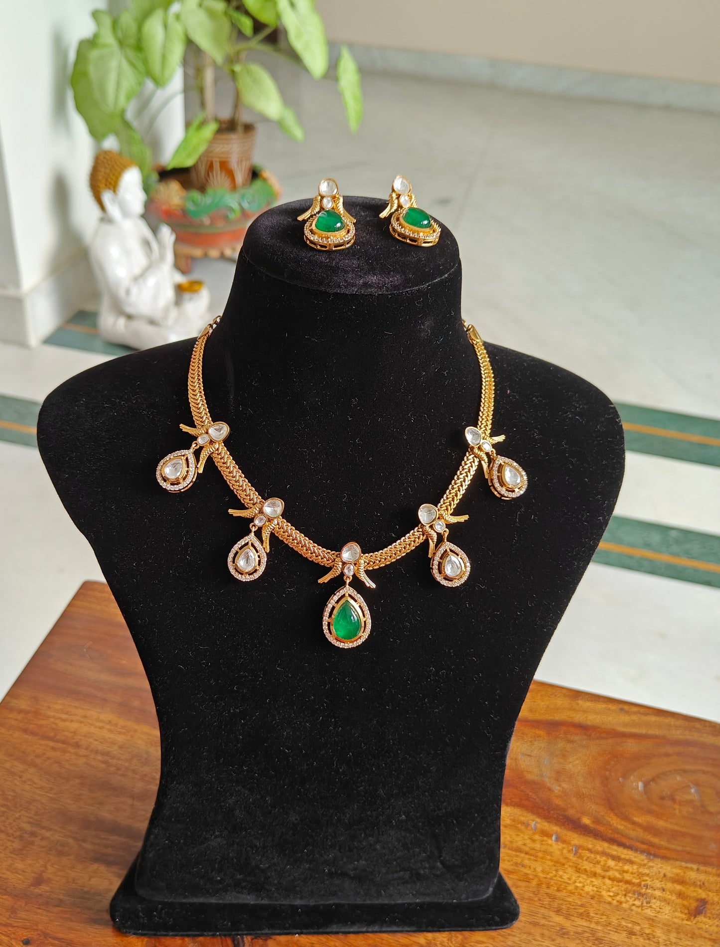 Surina set with moissanite and emerald green stone