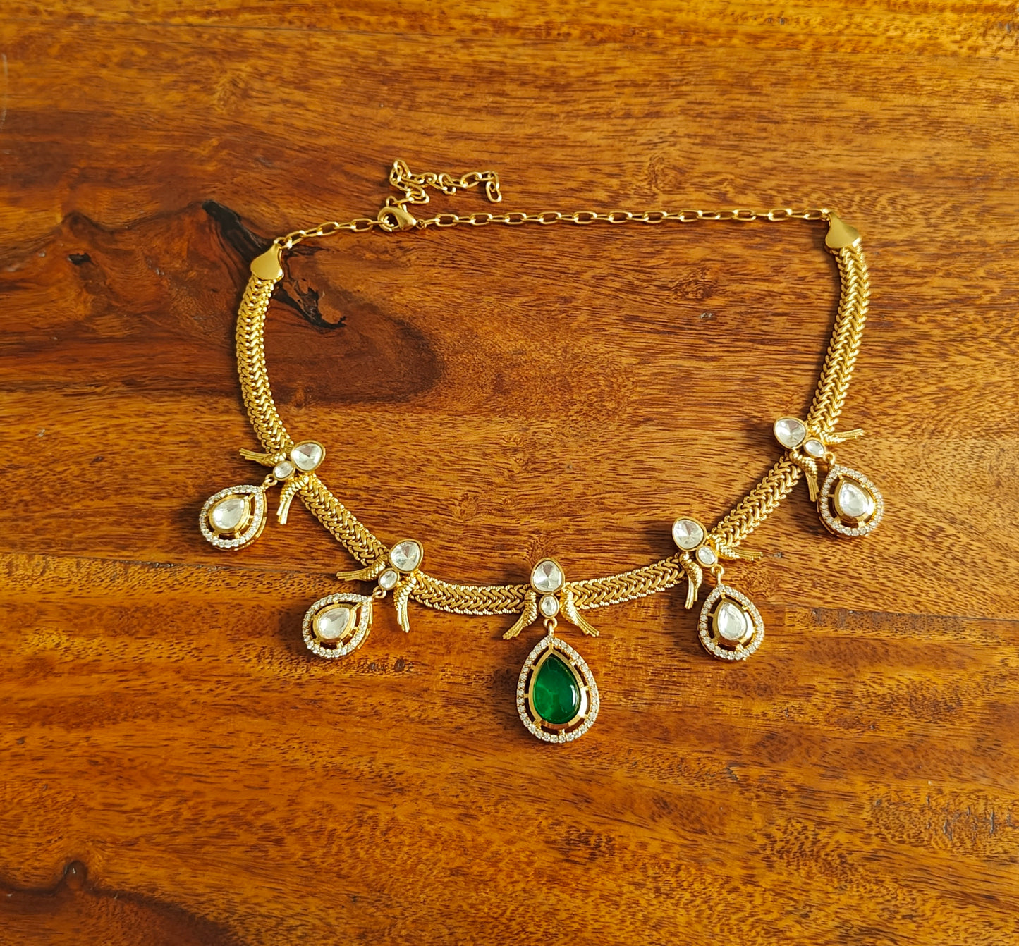 Surina set with moissanite and emerald green stone
