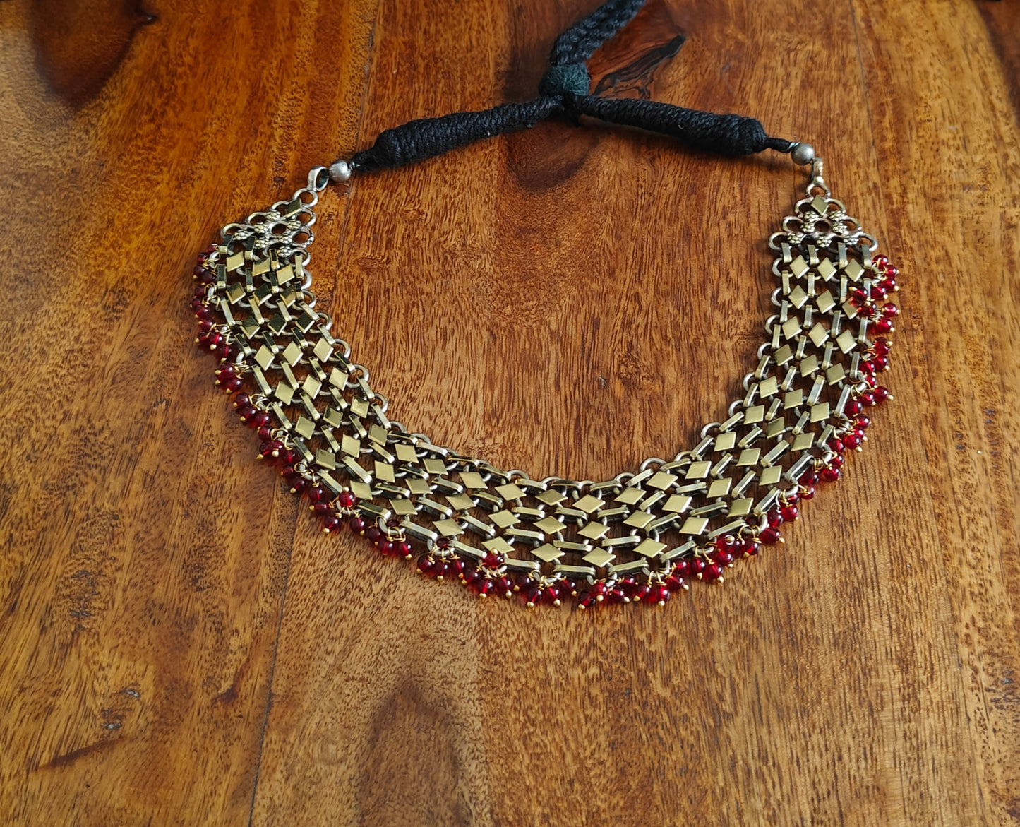 Chaya dual tone necklace with red bead hangings