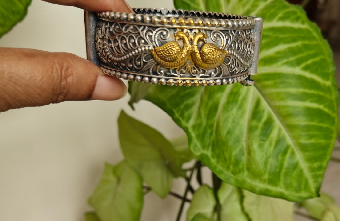 Dual tone kara with peacock engraving