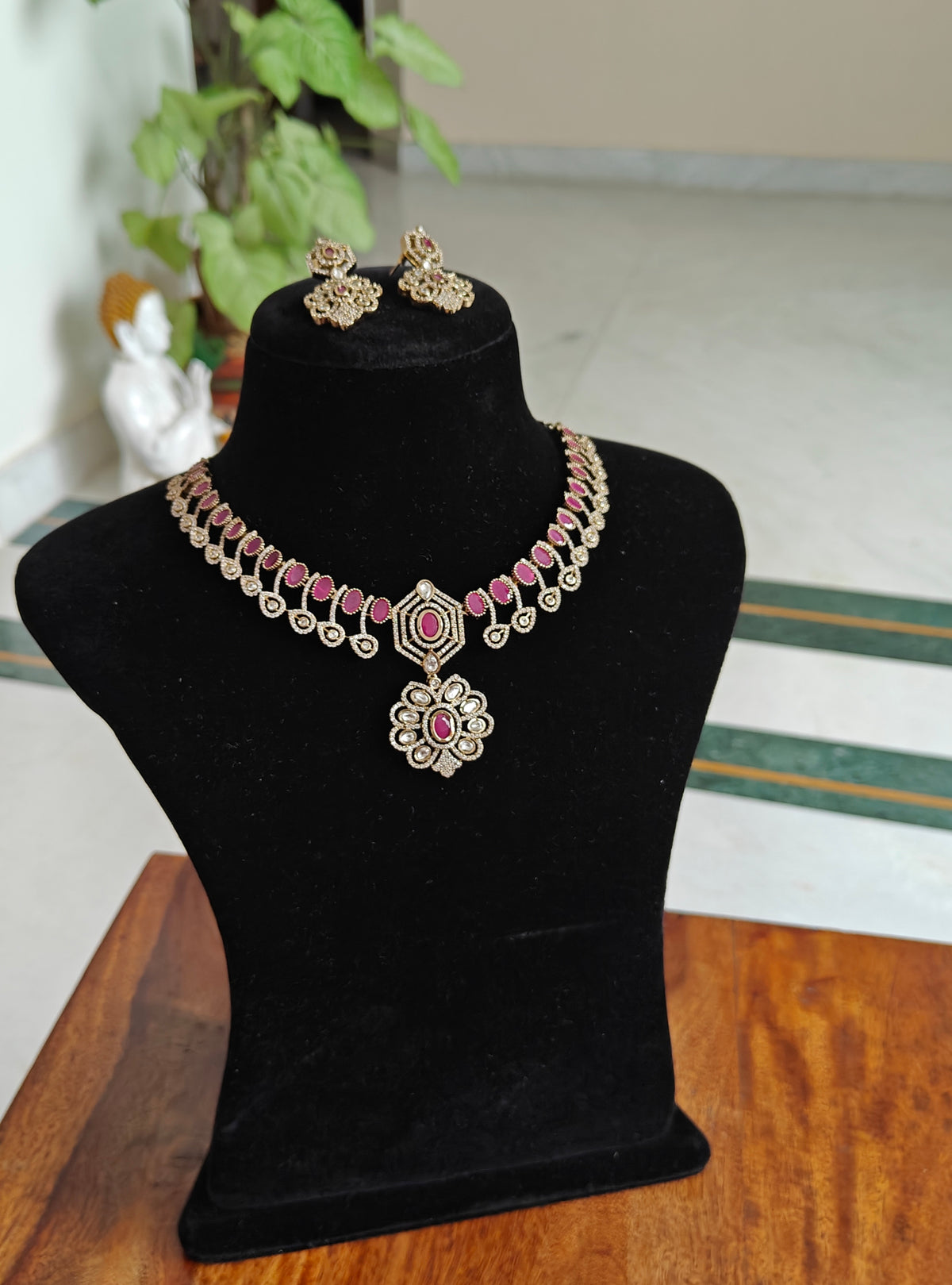 Sameena set with stones and a flower pendant below