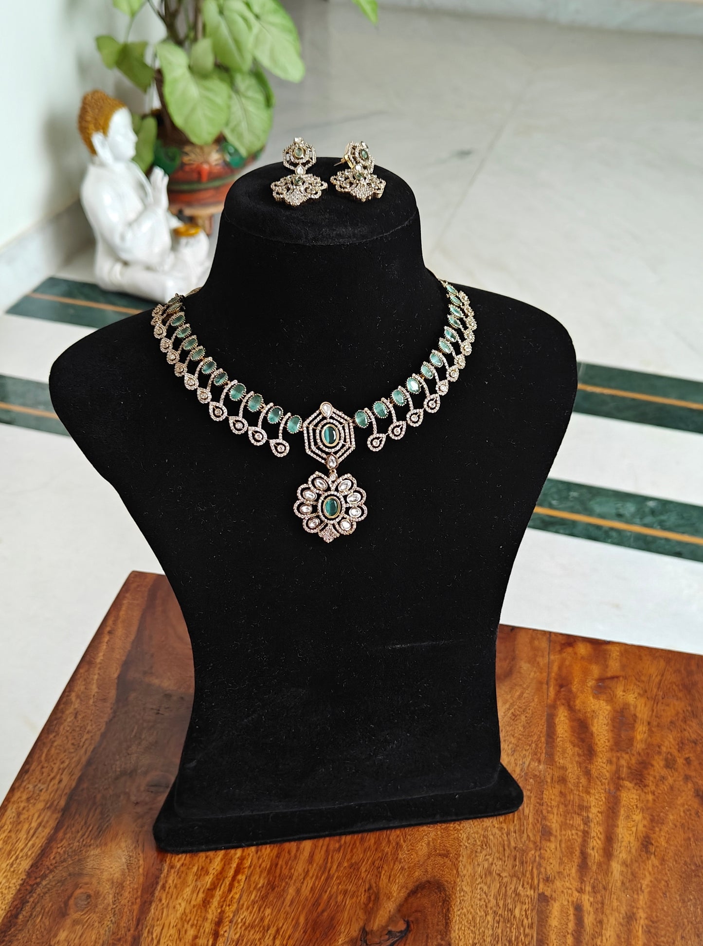 Sameena set with stones and a flower pendant below