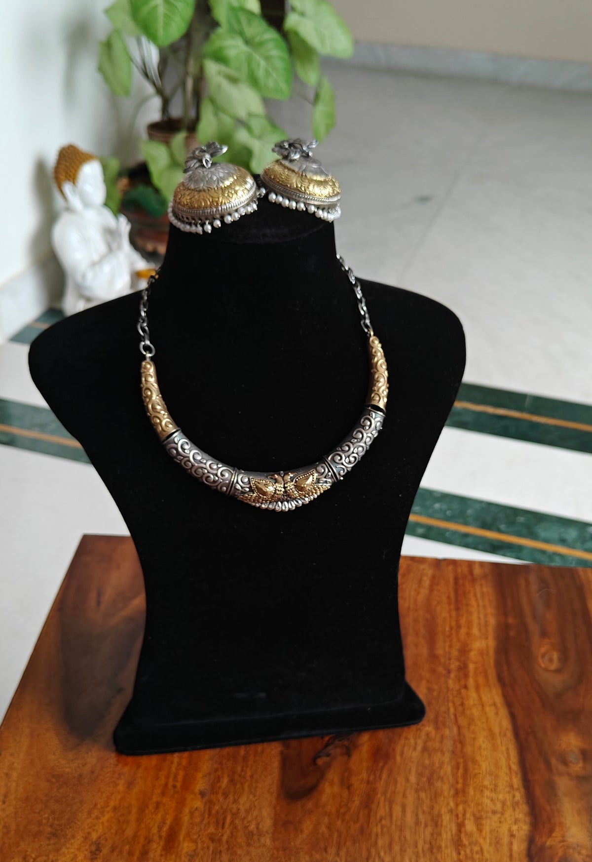 Dual tone choker with peacock engraving in centre