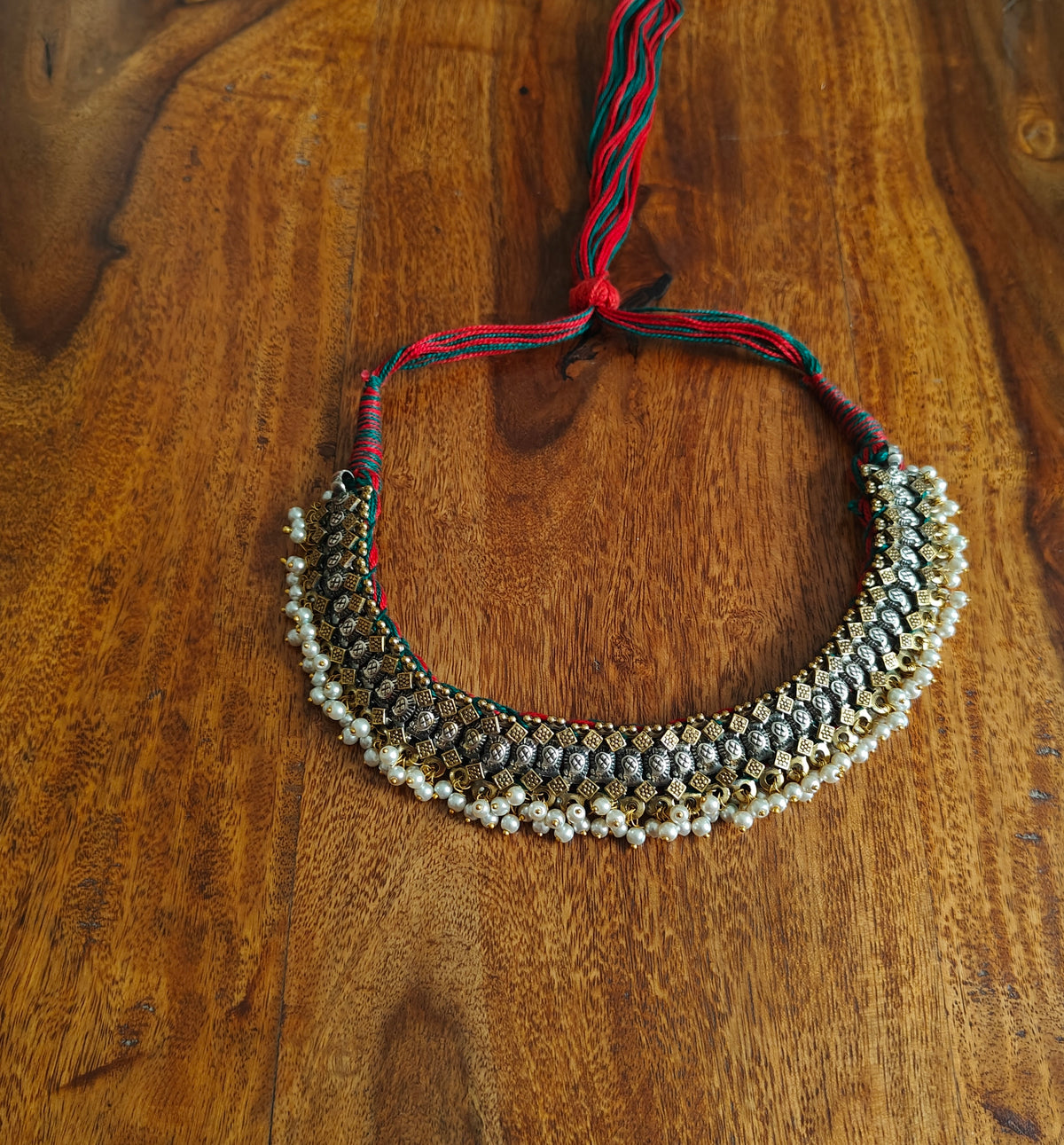 Dual tone necklace with pearls below