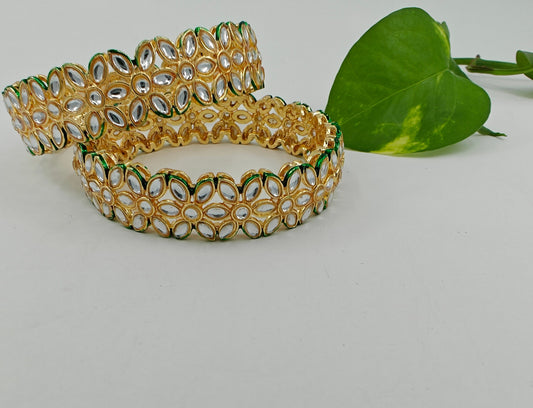 Bangles/ karas in gold finish with flower motif all around(2pcs)