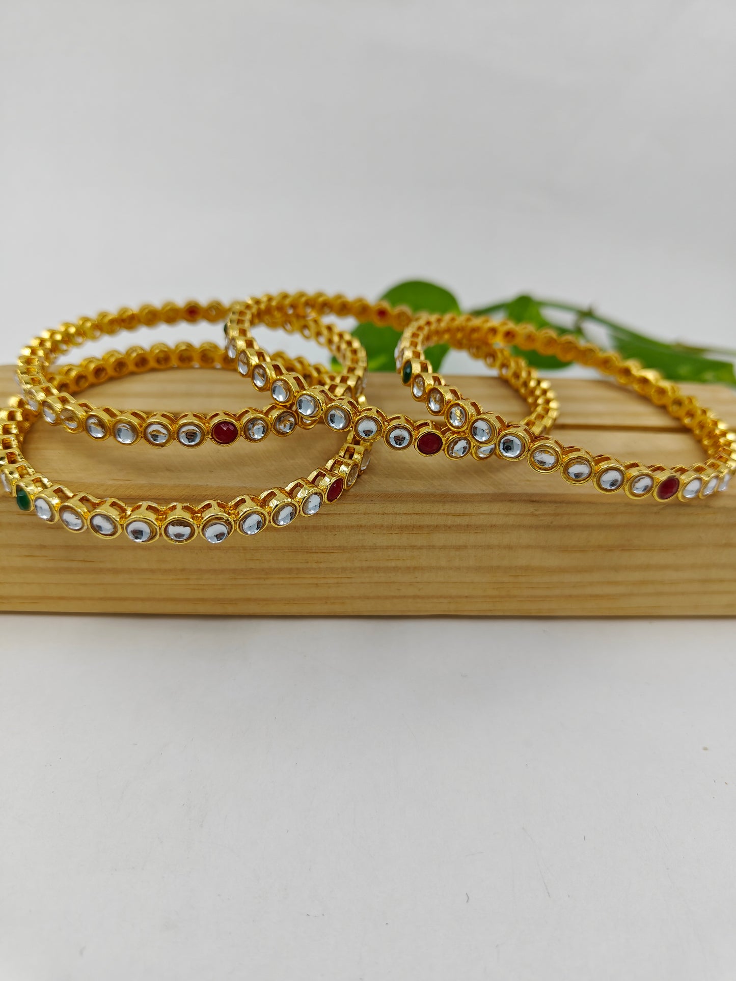 Gold finish bangles (4pcs) with red white and green kundan