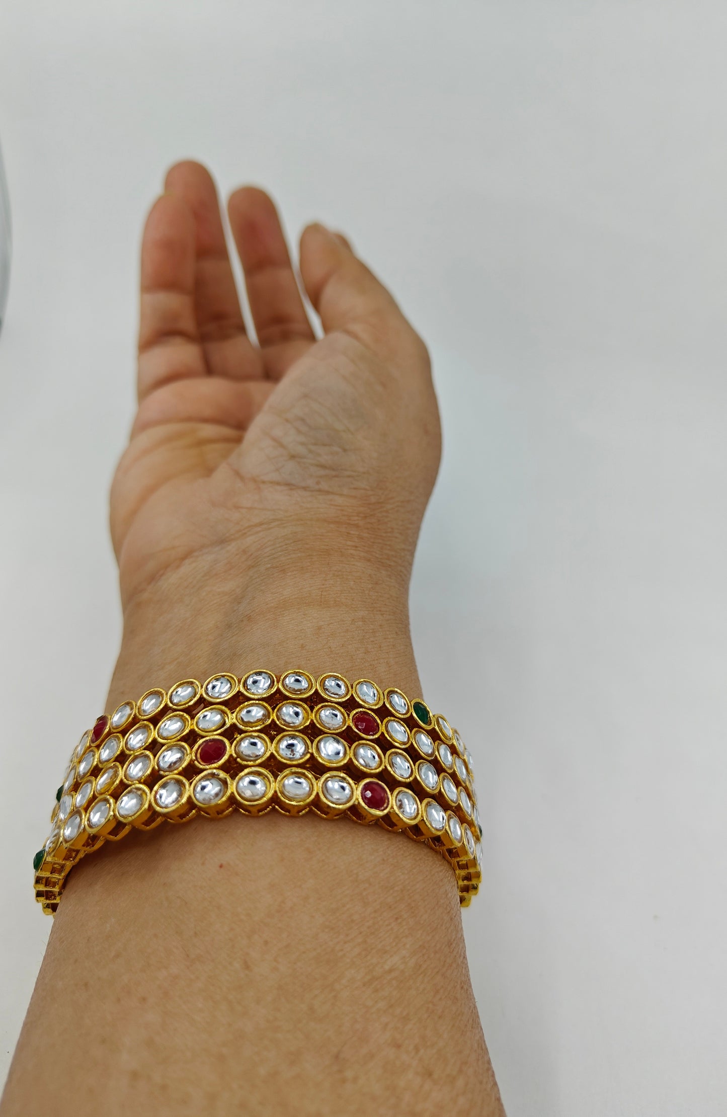 Gold finish bangles (4pcs) with red white and green kundan