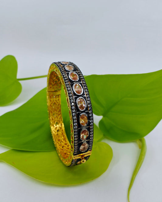 Gold finish bangle/kara with champage colour stone