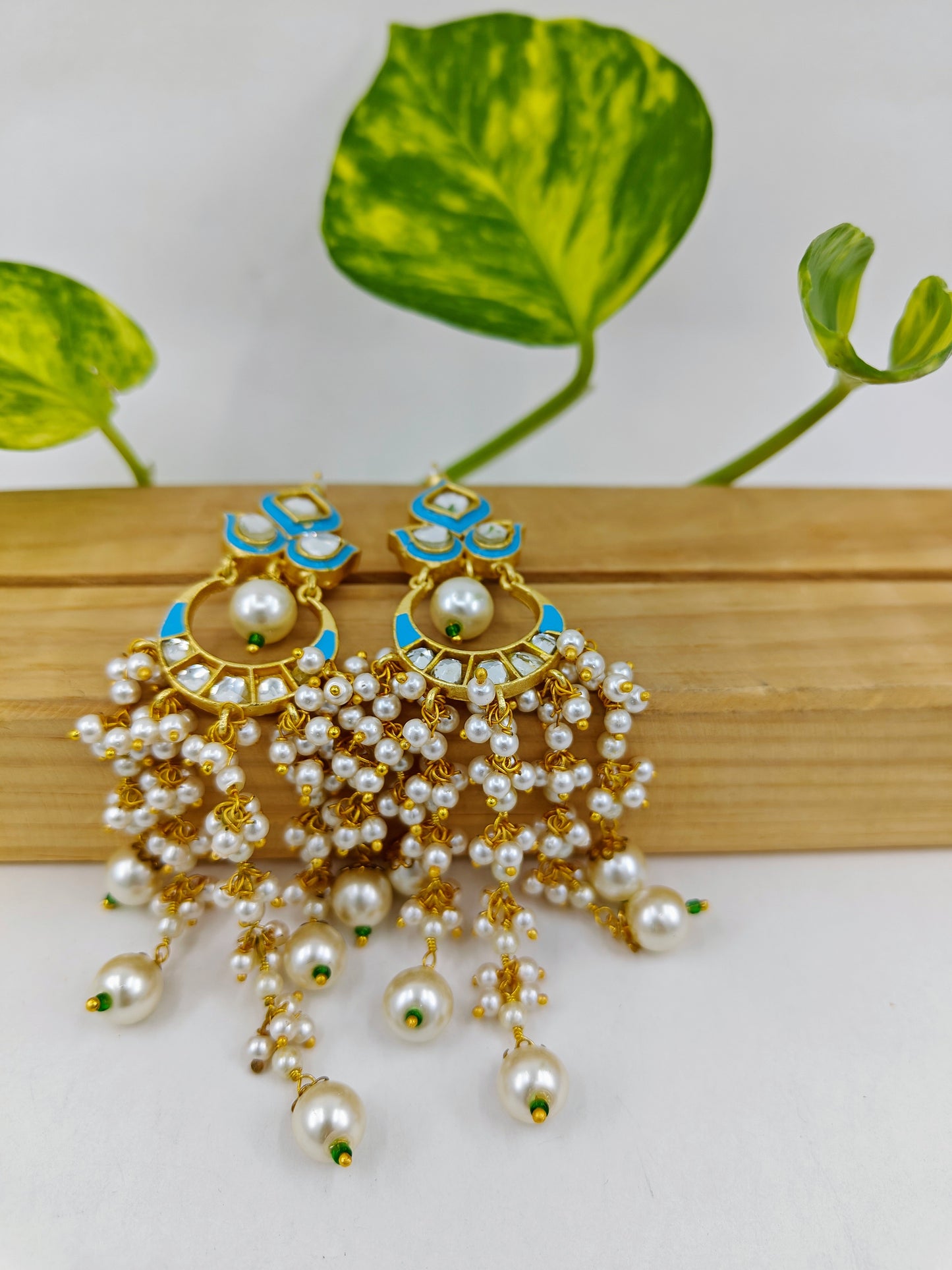 Gold finish kundan earrings with blue/teal green meenakari with pearl haangings