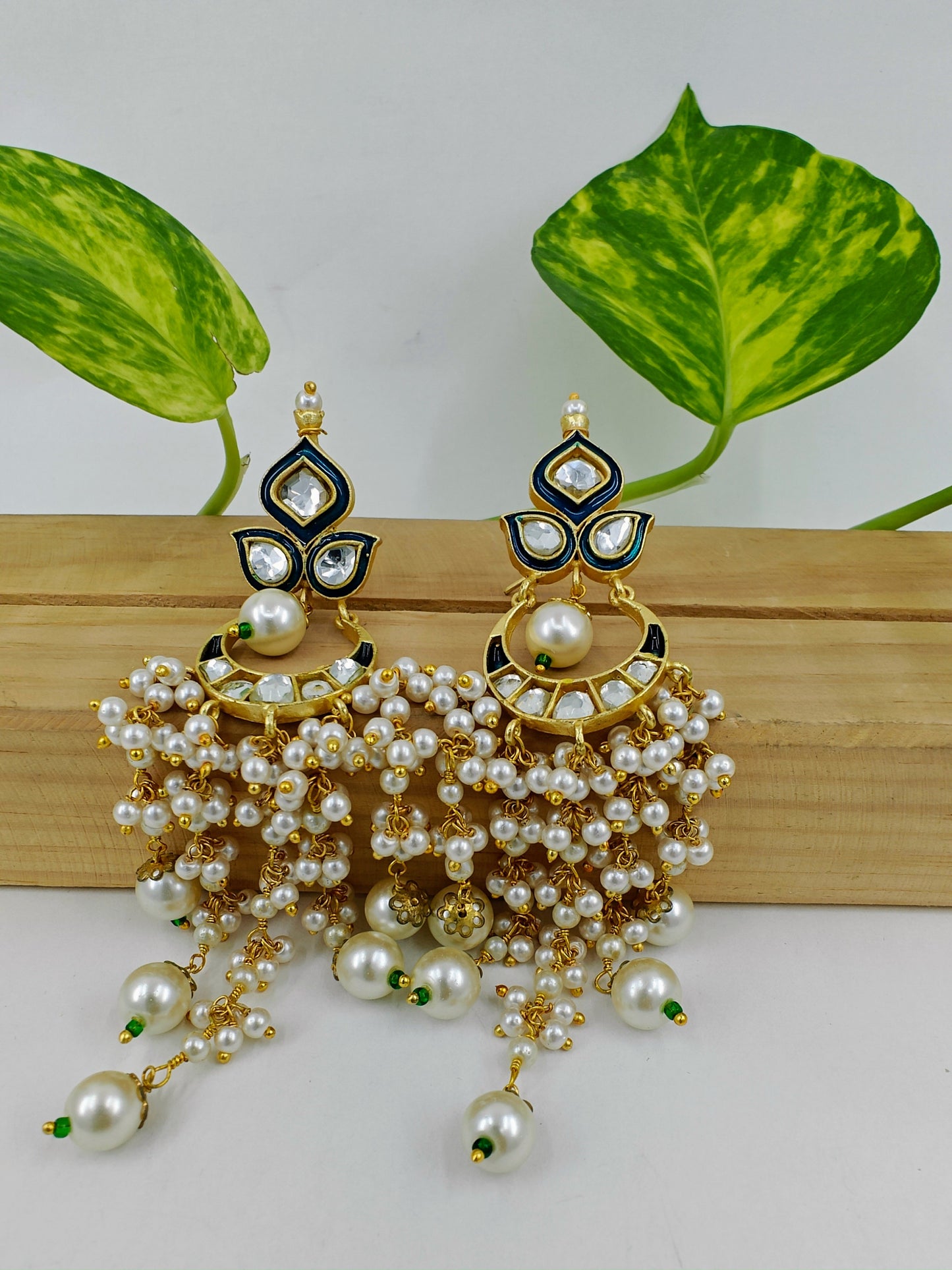 Gold finish kundan earrings with blue/teal green meenakari with pearl haangings