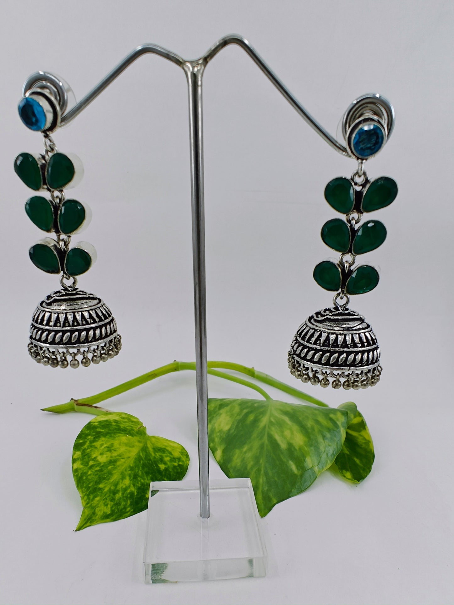 Silver/dual tone finish hanging jhumkis (earrings)on leaf dangler with stones