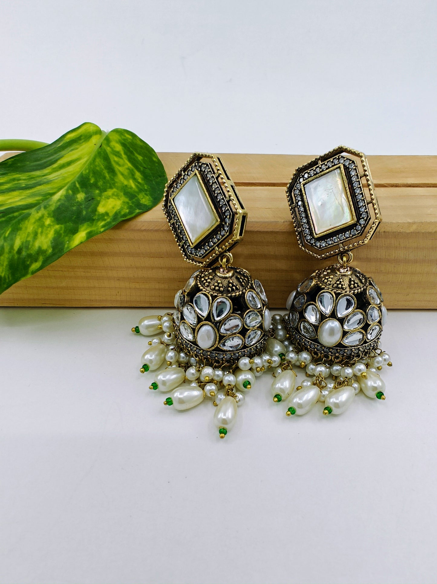 Jhumkas( earrings) in antique finish with kundan and coloured stone