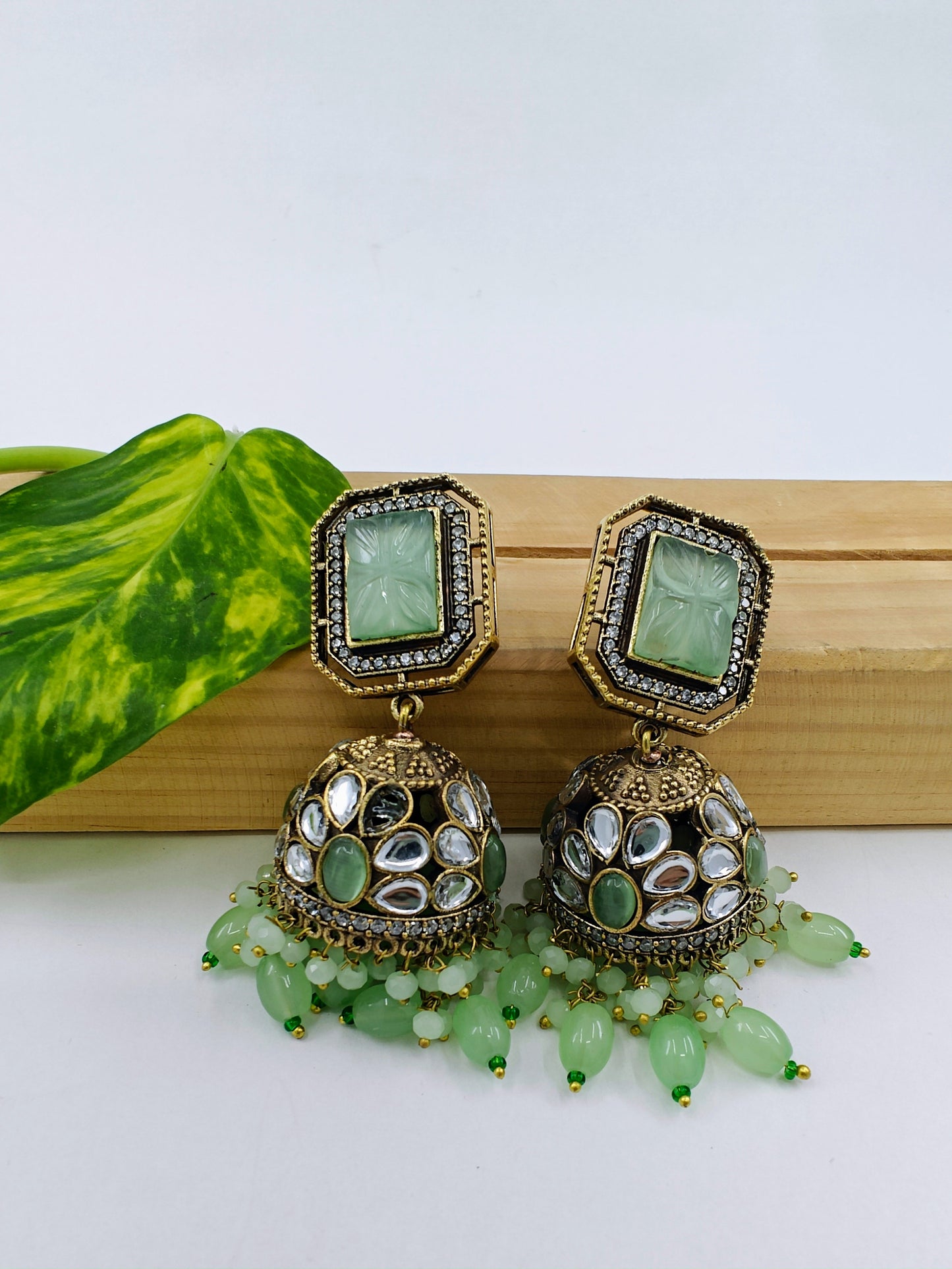 Jhumkas( earrings) in antique finish with kundan and coloured stone